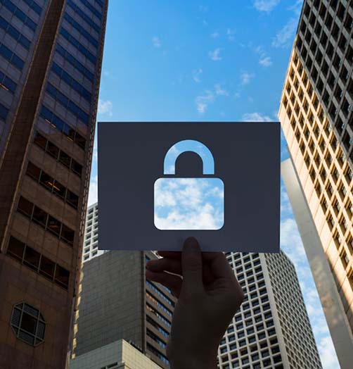 Padlock against city skyline - protection rules that travel with every document